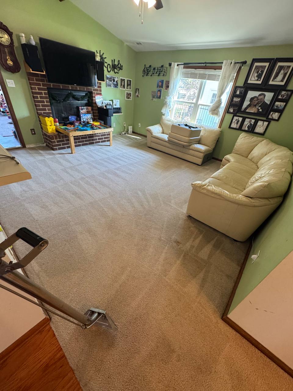 Before and after carpet cleaning in a furnished living room after
